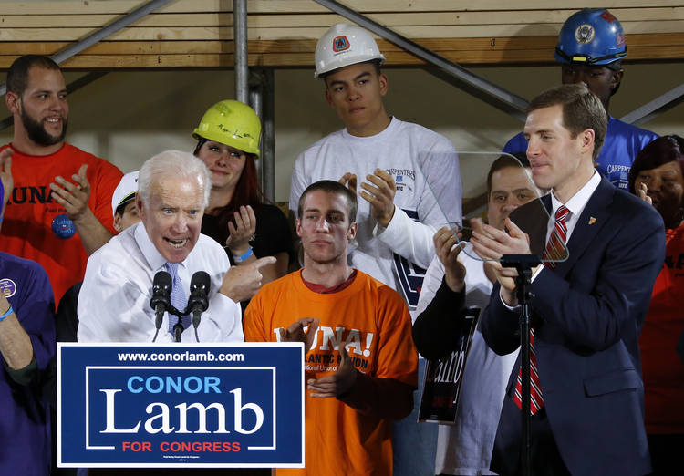 Joe Biden campaigns Tuesday for Democratic candidate Conor Lamb, right, at the Carpenter's Training Center in Collier, Pa. (Gene J. Puskar/AP)