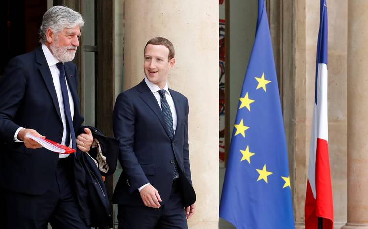 Facebook CEO Mark Zuckerberg and Maurice Levy, chairman of the Supervisory Board of Publicis Groupe, leave a technology summit May 23 at the Elysee Palace in Paris. (Christian Hartmann/Reuters)