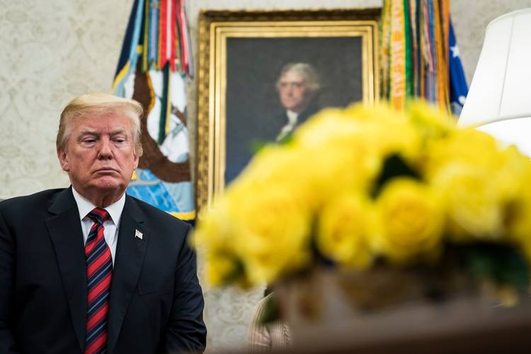 President Trump listens during an Oval Office meeting. (Jabin Botsford/The Washington Post)