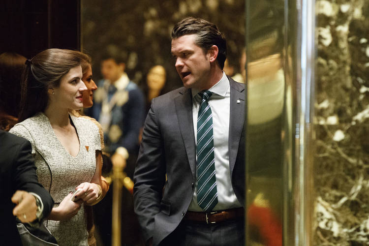 Fox News host Pete Hegseth heads to a meeting with Donald Trump at Trump Tower in December 2016. (Evan Vucci/AP)