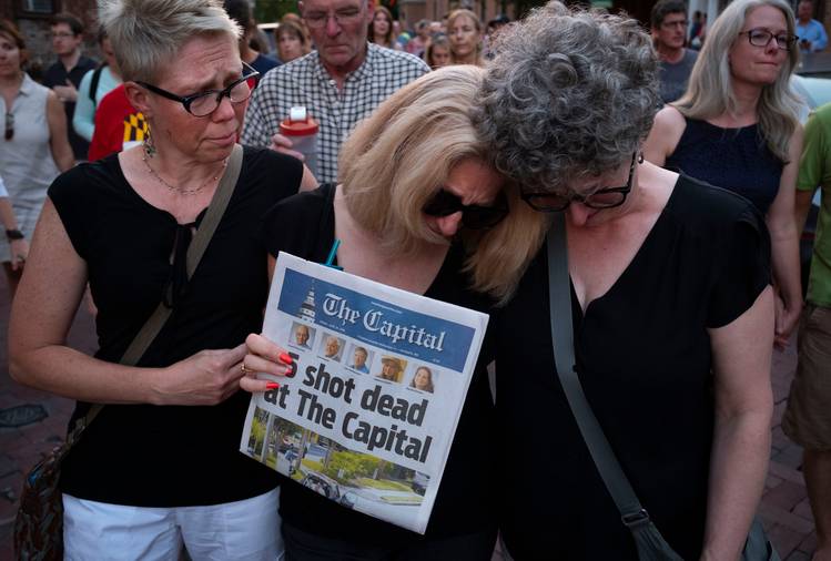 Andrea Chamblee, wife of shooting victim and reporter John McNamara, marches in a vigil held in downtown Annapolis. (Calla Kessler/The Washington Post)