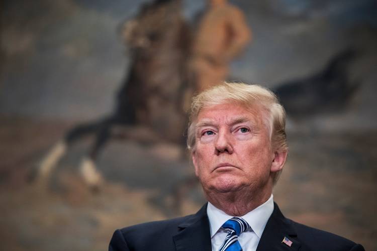 President Trump listens to others speak before signing proclamations announcing tariffs on steel and aluminum imports. (Jabin Botsford/The Washington Post)