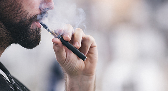 Man vaping with e-cigarette