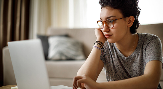 Concerned woman with laptop