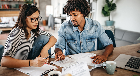 Man and woman going over financial statements