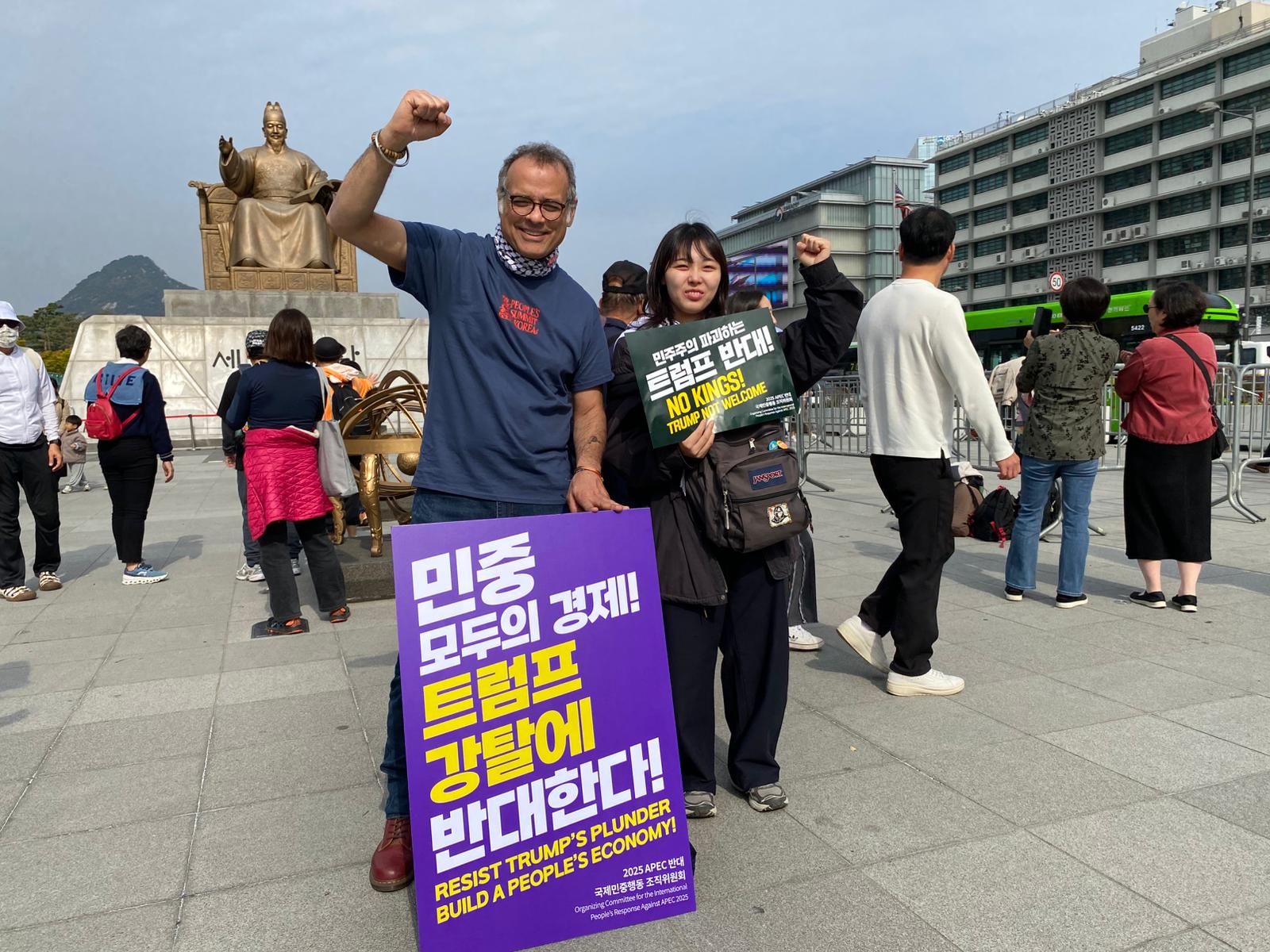 The author with a young Korean activist in front of the US embassy and King Sejong