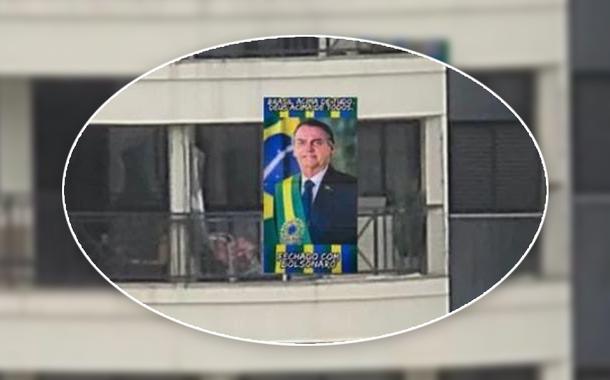 Morador estende bandeira de Bolsonaro na sacada, mas só não contava com reação de vizinho; entenda