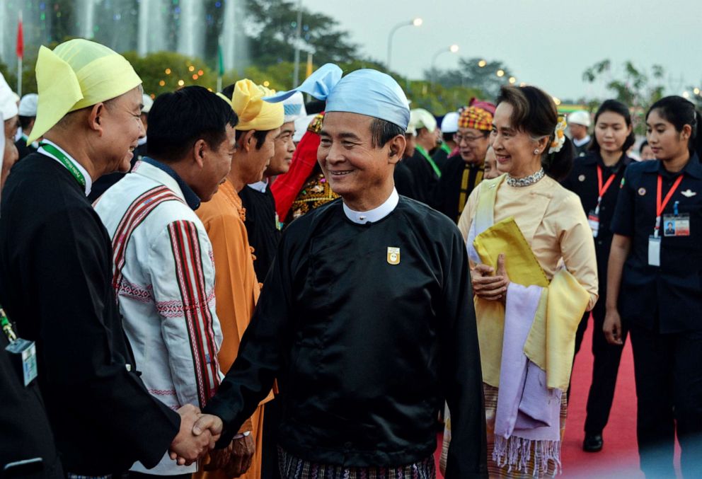 Myanmar's President Win Myint and Myanmar State Counsellor Aung San Suu Kyi arrive to attend a reception to mark the 72nd anniversary of country's National Union Day in Naypyidaw, Feb. 12, 2019.