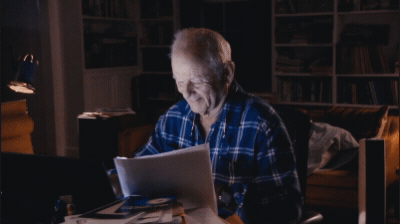 Gif of Bill Murray sitting in a dimly lit room typing away at the computer. - GIF