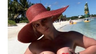 Britney Spears Wore Nothing But a Pink Fedora in New Beach Instagrams