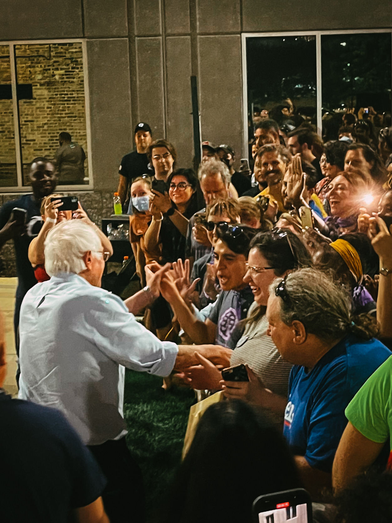 Bernie speaking with rallygoers