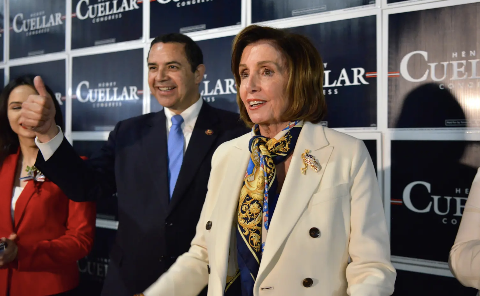 Nancy Pelosi at a campaign event for Henry Cuellar in 2020. Cuellar stands behind Pelosi giving a thumbs up