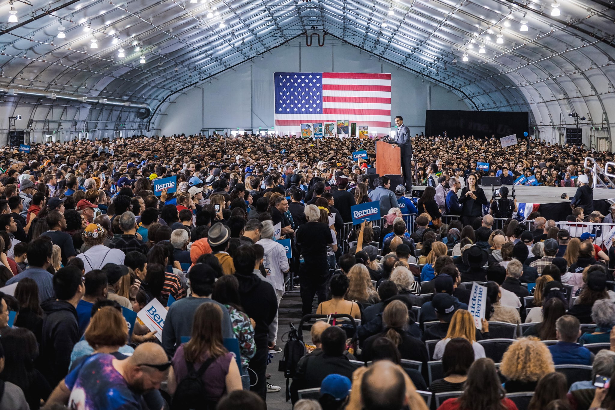 Ro speaking in front of a huge crowd at a Bernie Sanders rally