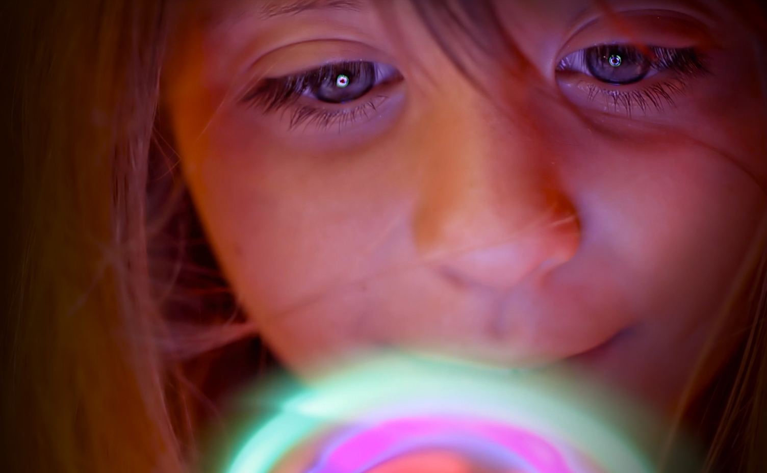 Girl playing with toy light