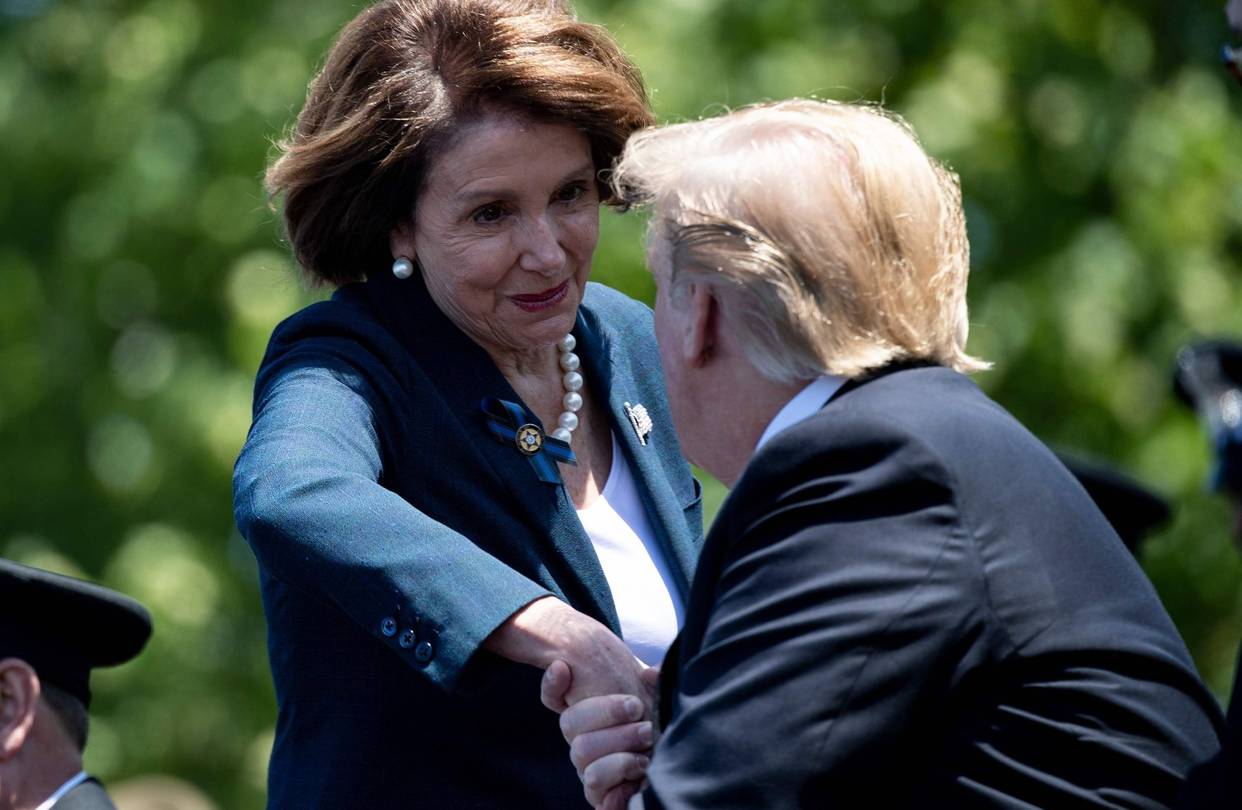 House Speaker Nancy Pelosi shakes hands
with President Trump in Washington, May 15.