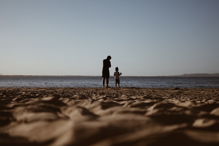 Father And Son On A Sea Shore