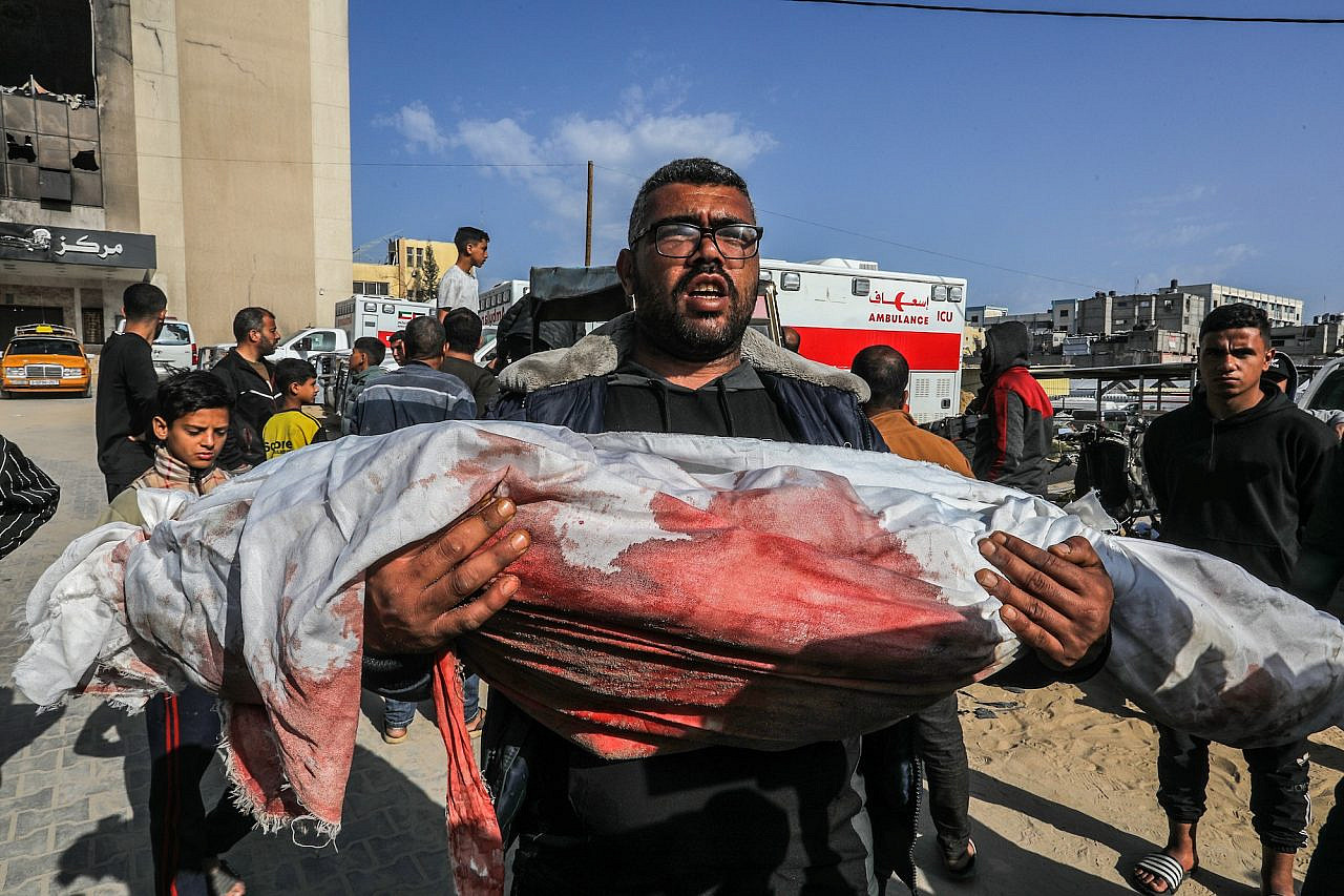 Palestinians mourn those killed in an Israeli airstrike, Nasser Hospital, Khan Younis, southern Gaza Strip, March 18, 2025. (Abed Rahim Khatib/Flash90)