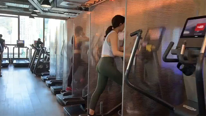 Gym In Hong Kong, Glassseparate The Cardio Machines To Help Prevent Droplets From Spreading