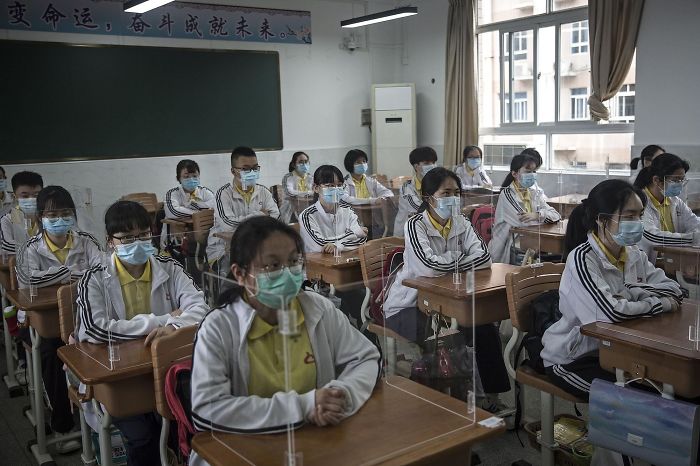Each Student Has A Clear Tri-Fold Board Around Their Desk