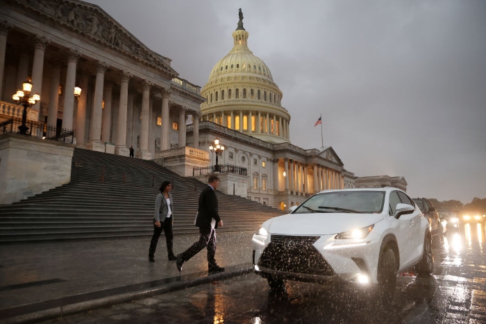 Nightly 10-18-21 photo Members of the U.S. House of Representatives head to their cars following a vote at the U.S. Capitol.