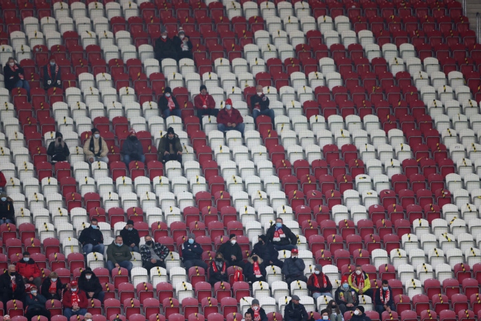 Nightly 12-16-21 photo 2 Fans sit with some social distancing during a soccer match between 1. FSV Mainz 05 and VfL Wolfsburg at MEWA Arena in Mainz, Germany.