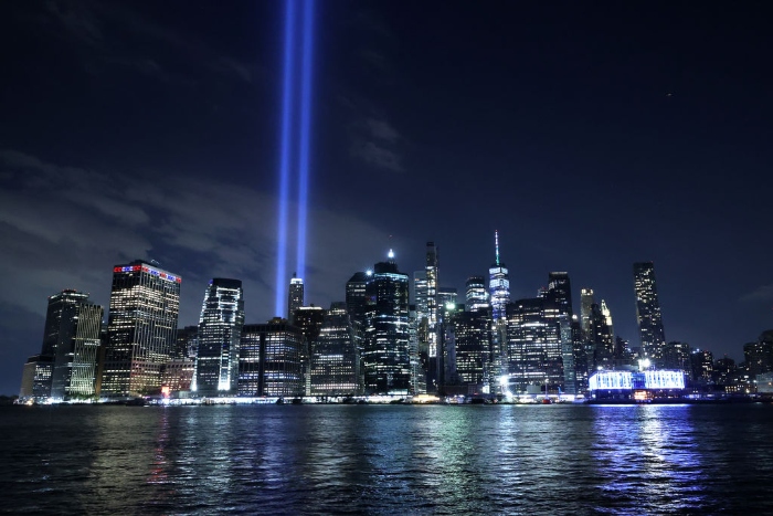 Nightly 9-10-21 photo 1 The Tribute In Light shines into the sky from Lower Manhattan as seen from the Brooklyn borough of New York City.