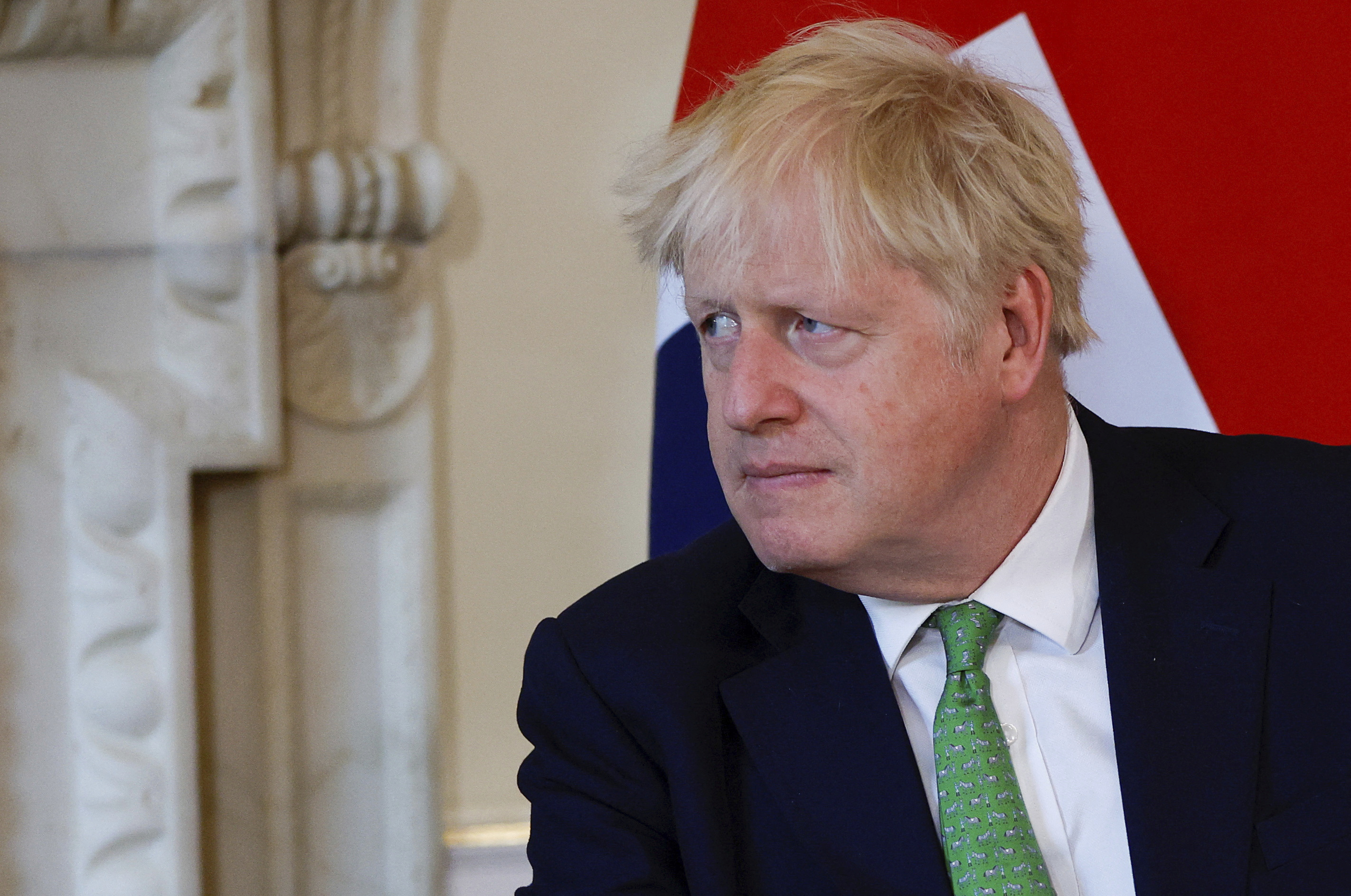 British Prime Minister Boris Johnson attends a meeting.