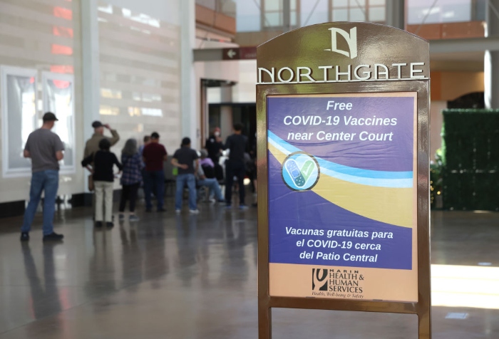 People line up for a Covid-19 vaccine at a vaccination clinic in San Rafael, Calif.