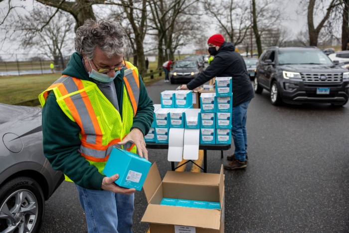 Nightly 1-3-22 photo Stamford city workers hand out free at-home Covid-19 test kits in Stamford, Ct.