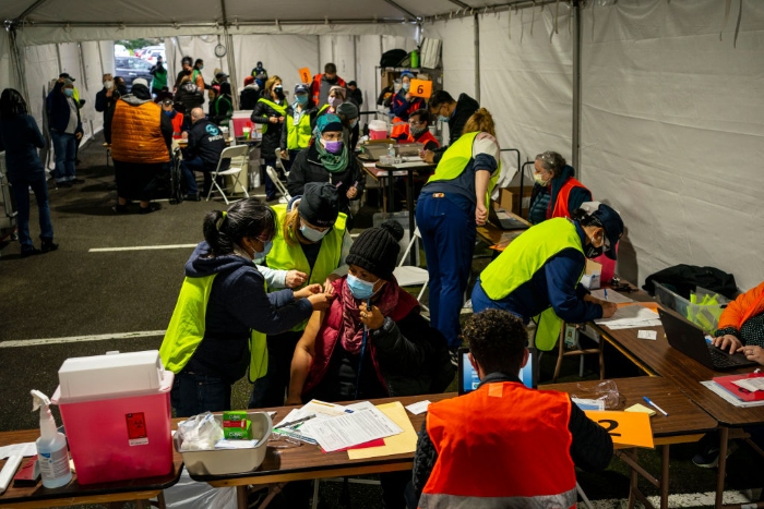 Nightly 2-4-21 photo A patient receives a Covid-19 vaccination in Federal Way, Wash.