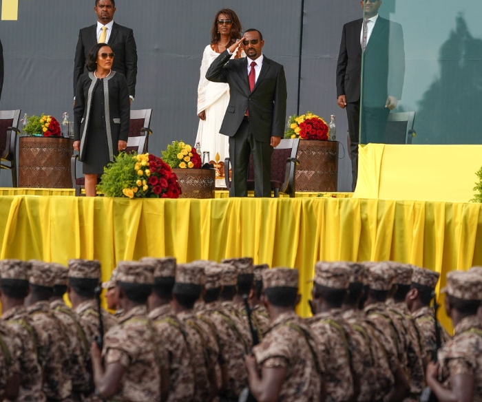 Nightly 11-5-21 photo Prime Minister Abiy Ahmed salutes members of the Ethiopian Military as they march during an inaugural celebration after Ahmed was sworn in for a second five year term in October in Addis Ababa.