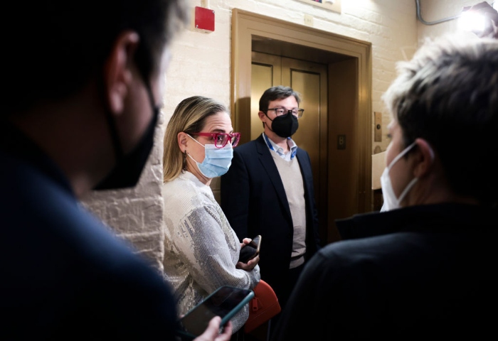 Nightly 10-25-21 photo Sen. Kyrsten Sinema leaves her office after meeting with Sen. Joe Manchin in the U.S. Capitol Building.