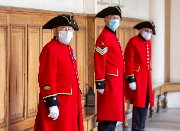 Nightly 7-15 photo Retirees are seen wearing protective face masks during a visit by Camilla, Duchess Of Cornwall, to the Royal Hospital Chelsea in London.