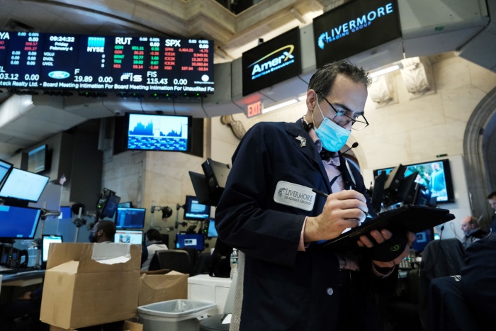 Nightly 2-8-22 stocks Traders work on the floor of the New York Stock Exchange.