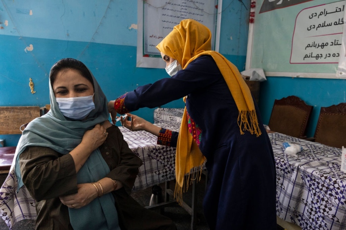 Nightly 8-20-21 photo 1 A 10th-grade teacher at the Zarghoona high school gets vaccinated with the Johnson & Johnson Covid-19 vaccine in July in Kabul, Afghanistan.