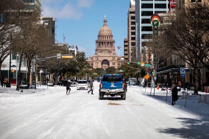 The Texas Capitol is surrounded by snow in Austin, Texas. Historic cold weather in Texas has caused traffic delays and power outages, and storms have swept across 26 states with a mix of freezing temperatures and precipitation. 