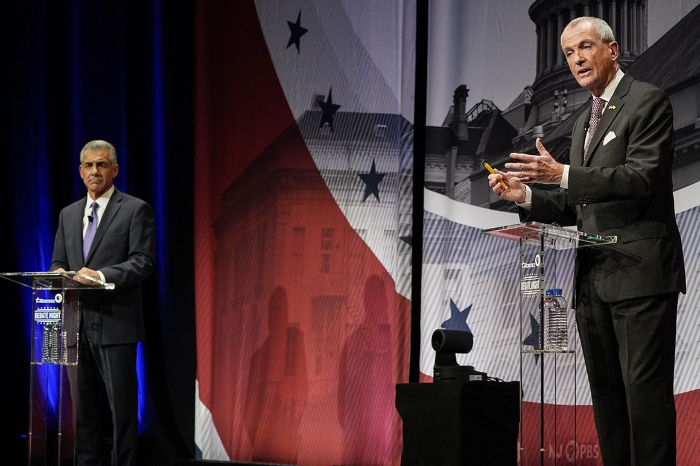 Nightly 10-22-21 photo 2 Incumbent Gov. Phil Murphy, right, speaks while Republican challenger Jack Ciattarelli listens during a gubernatorial debate at Rowan University's Pfleeger Concert Hall in Glassboro, N.J.