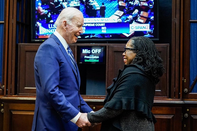 President Joe Biden holds hands with Supreme Court nominee Judge Ketanji Brown Jackson as they watch the Senate vote on her confirmation from the Roosevelt Room of the White House.