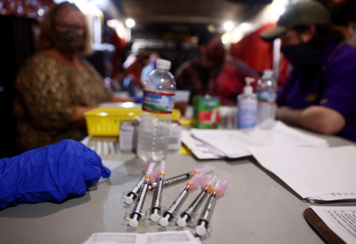Nightly 8-17-21 photo Covid-19 vaccination doses are ready to be administered at a popup vaccination clinic at Maple Leaf Bar in New Orleans.