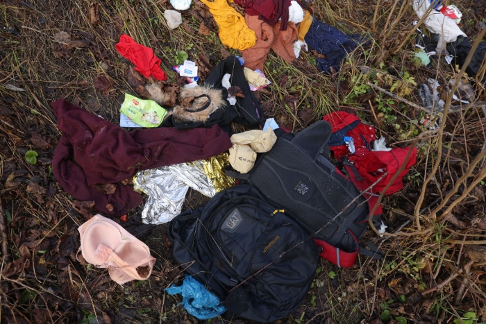 Nightly 11-11-21 photo 3 Items likely left behind by migrants, including documents showing that at least some of the members of the group were from Iraq and traveled to Minsk via Dubai, lie next to railroad tracks not far from the Belarus border near Hajnowka, Poland.