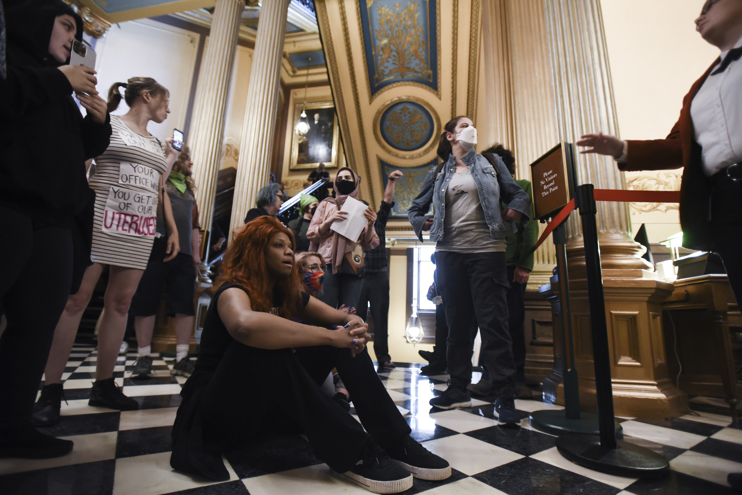 Abortion rights advocates rally outside the Michigan State House floor.