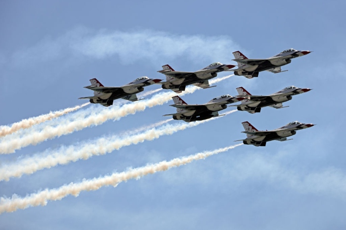 Nightly 12-13-21 photo 3 The United States Air Force Thunderbirds fly over the Huntington Beach Pier.
