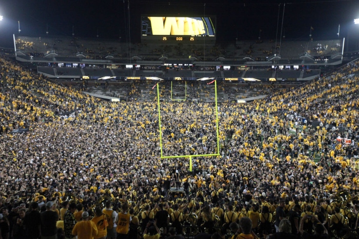 Nightly 10-14-21 photo Iowa Hawkeyes fans storm the field after the matchup against the Penn State Nittany Lions at Kinnick Stadium on Oct. 9 in Iowa City, Iowa.