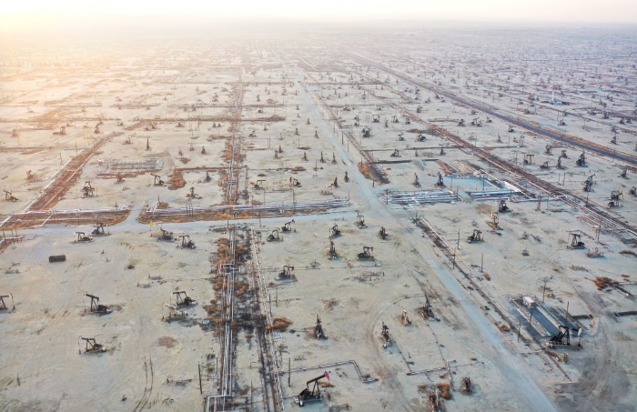 Nightly 11-22-21 photo 2 Some pumpjacks operate while others stand idle in the Belridge oil field near McKittrick, Calif.