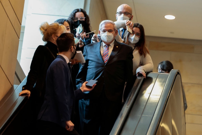 Nightly 2-10-22 menendez Sen. Bob Menendez (D-N.J.) surrounded by reporters.