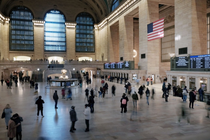 Nightly 1-25-22 photo People walk through Grand Central Terminal in New York City.