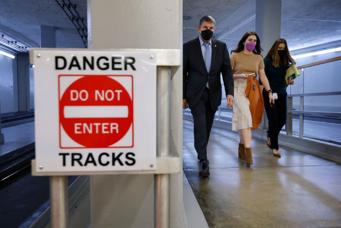 Nightly 1-10-22 photo Sen. Joe Manchin walks the tunnel between the Senate office buildings and the U.S. Capitol.