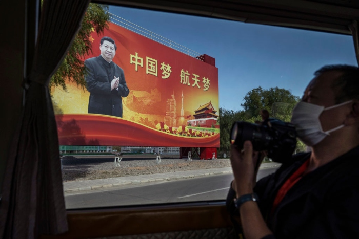 Nightly 11-12-21 photo 2 A billboard showing Chinese President Xi Jinping in Jiuquan, China.