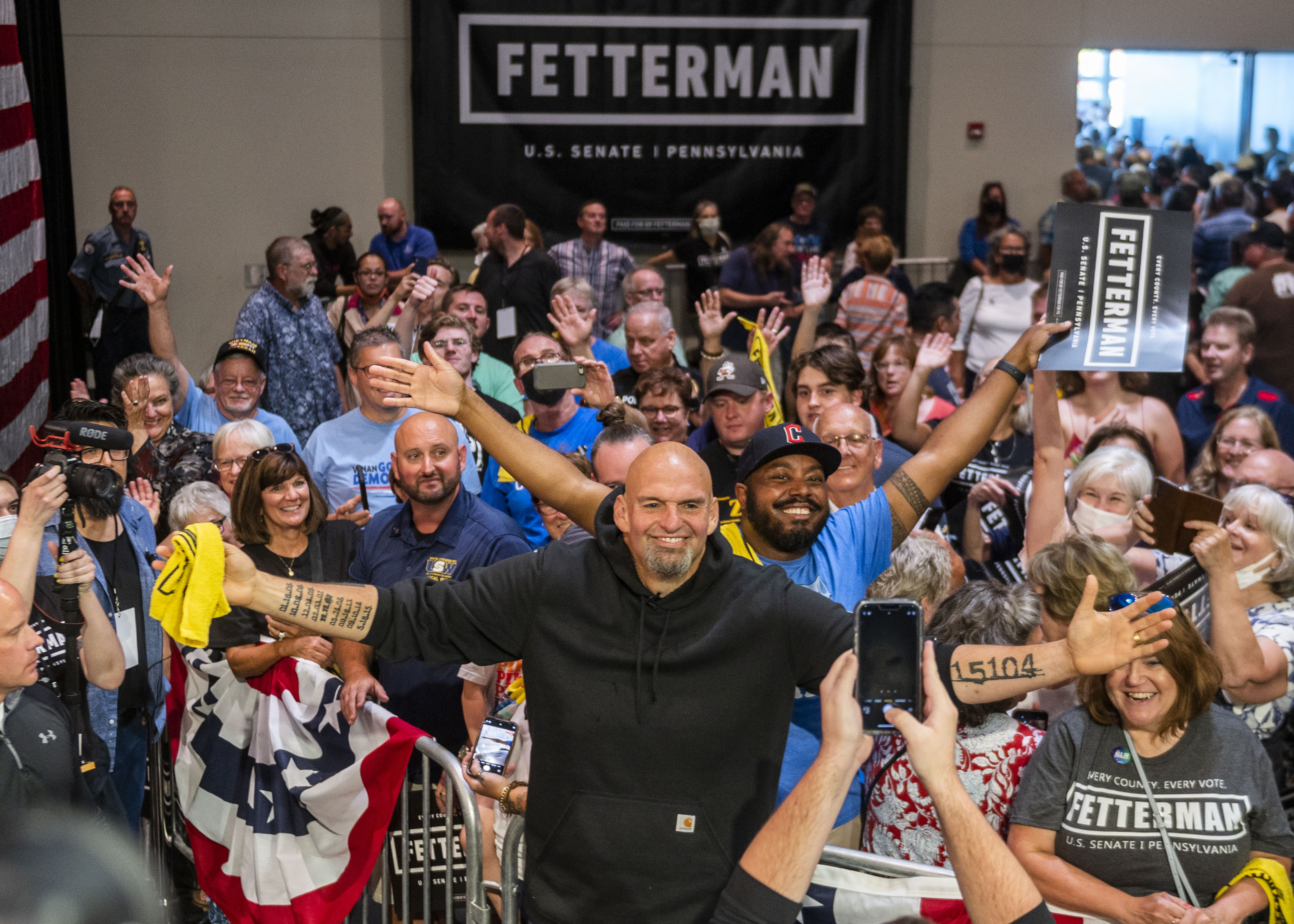 A photo of John Fetterman with supporters. 