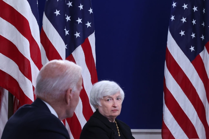 Nightly 10-26-2021 photo 3 Treasury Secretary Janet Yellen listens to President Joe Biden during a hybrid meeting with corporate chief executives and members of his cabinet in the Eisenhower Executive Office Building.